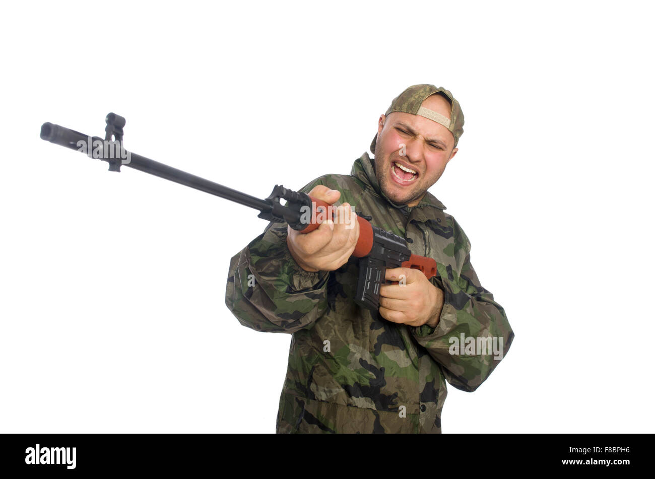 Young man in soldier uniform holding gun isolated on white Stock Photo