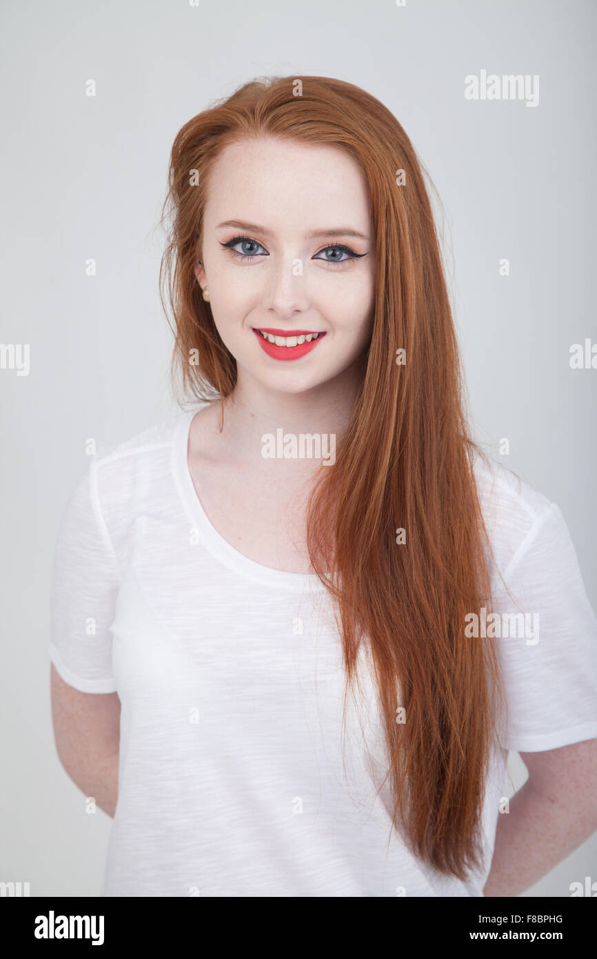 Young Scottish Woman with long red hair looking towards camera. Stock Photo