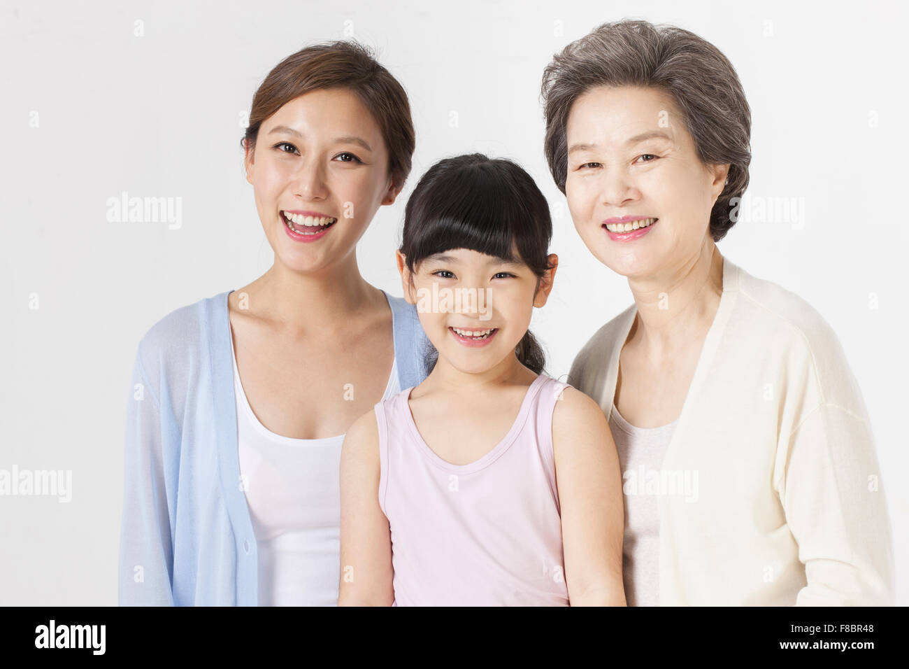 Mother, daughter, and granddaughter together smiling Stock Photo Alamy