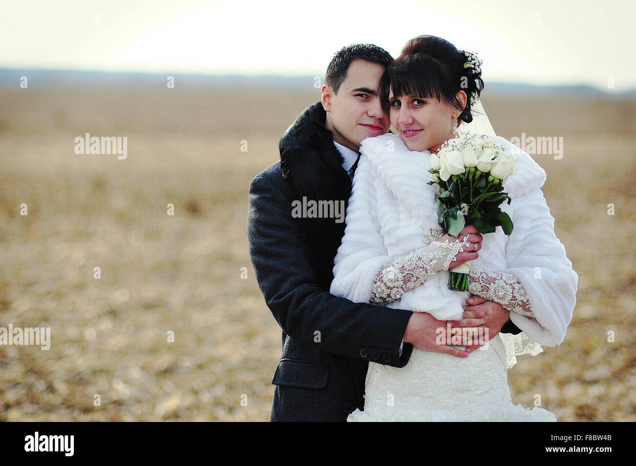 Happy and smiled wedding couple on corn field Stock Photo - Alamy