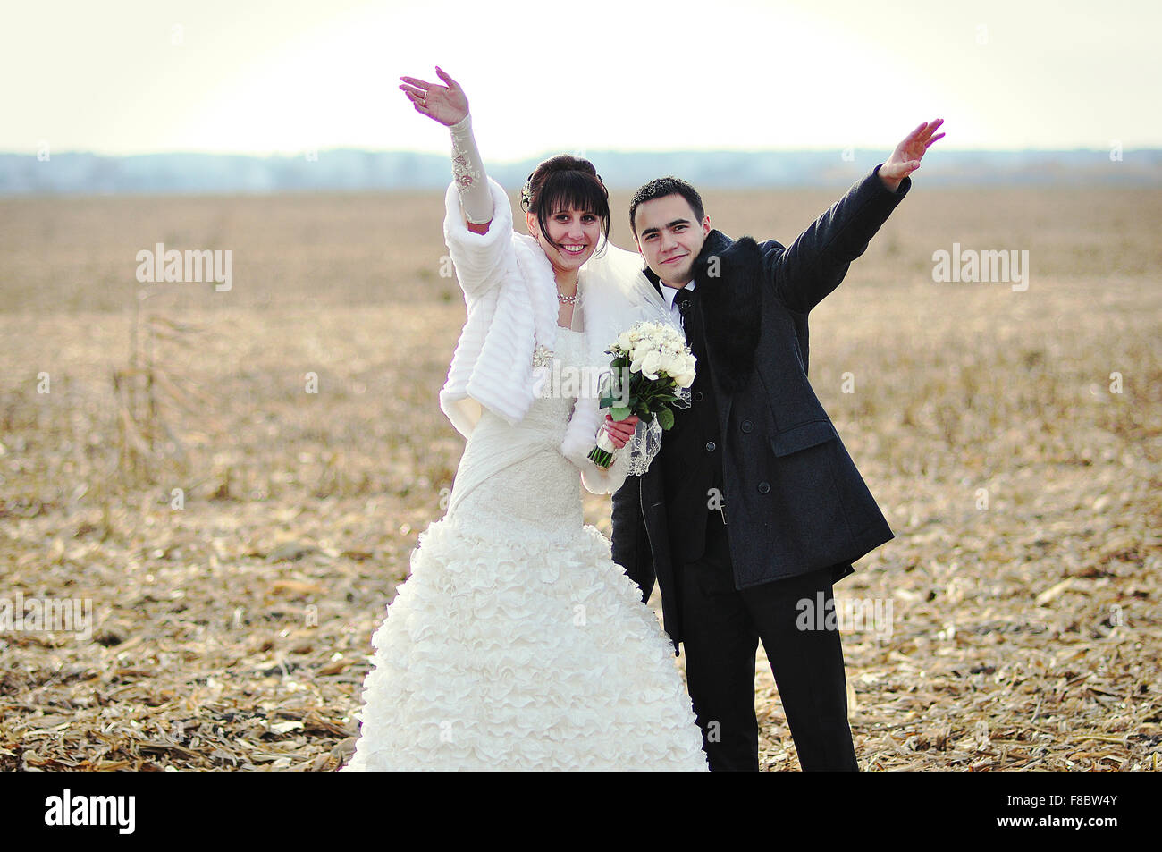 Happy and smiled wedding couple on corn field Stock Photo - Alamy
