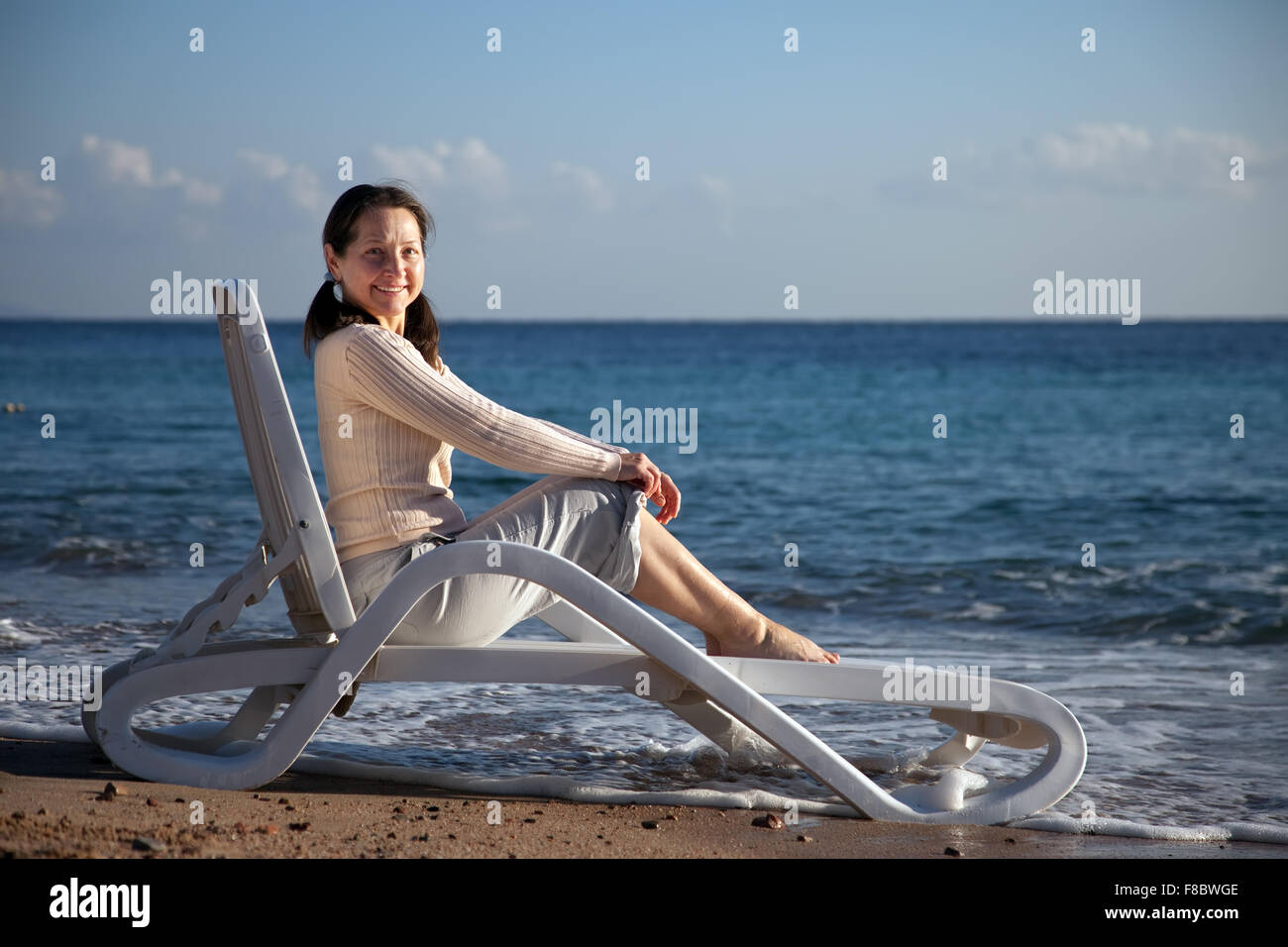 Relax sun lounger mature woman hi-res stock photography and images - Alamy