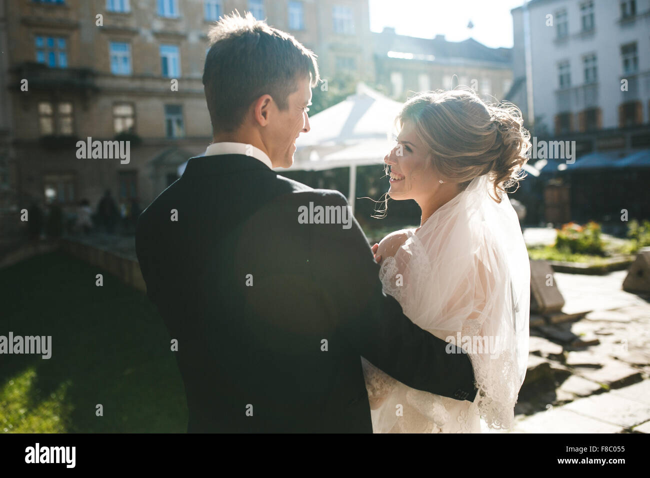 bride and groom posing on the streets Stock Photo - Alamy