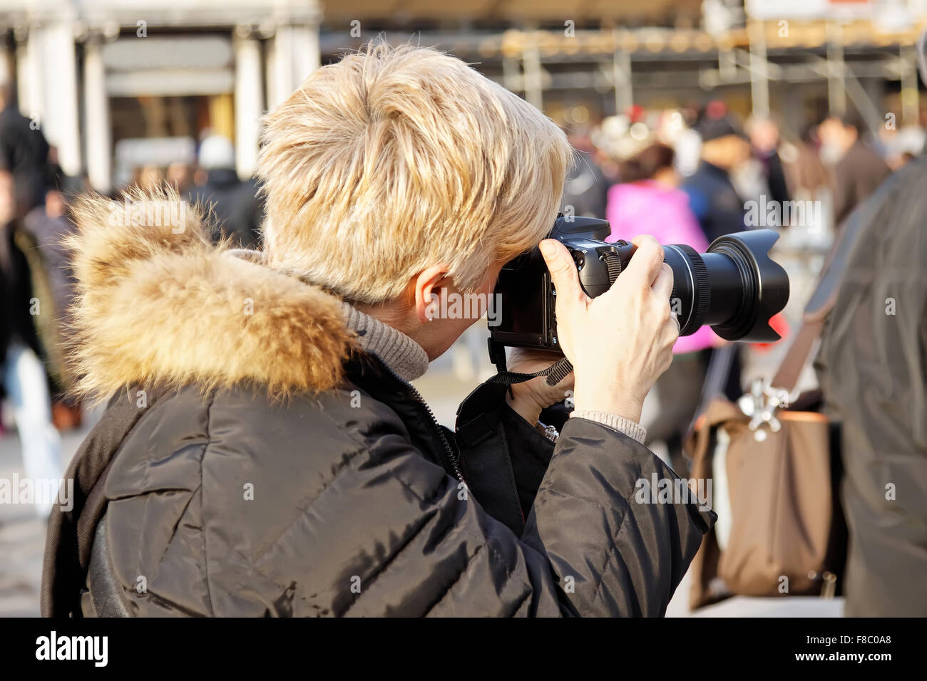 close up of female photographer at the park Stock Photo