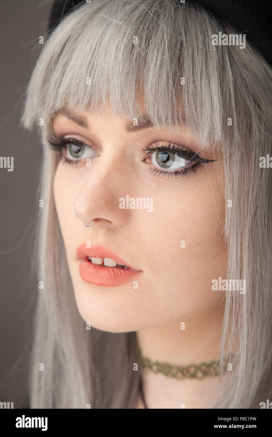 Portrait Of An Eighteen Year Old Woman With Dyed Gray Hair And A Nose