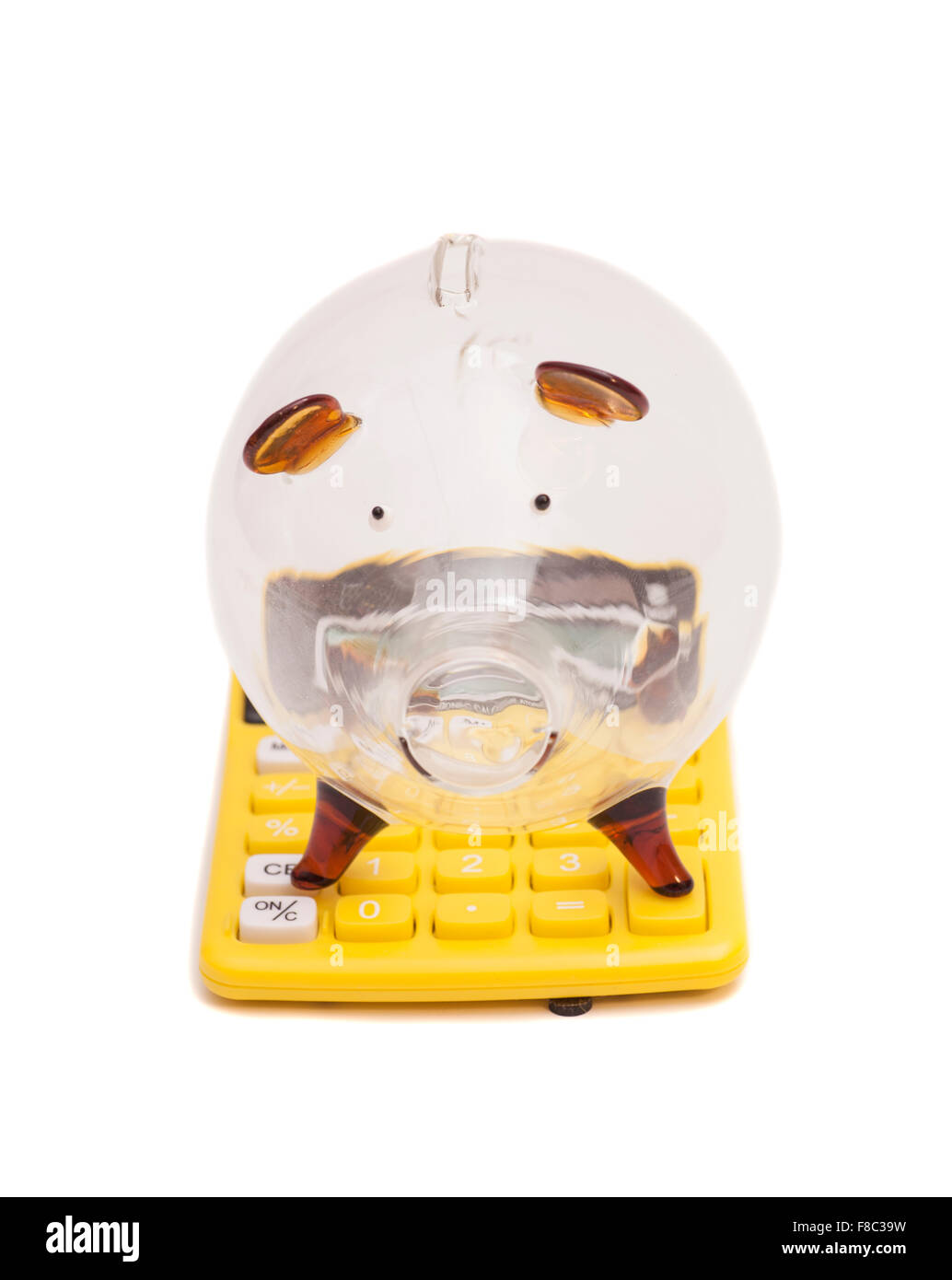 Piggy bank and callculator isolated on white background Stock Photo - Alamy