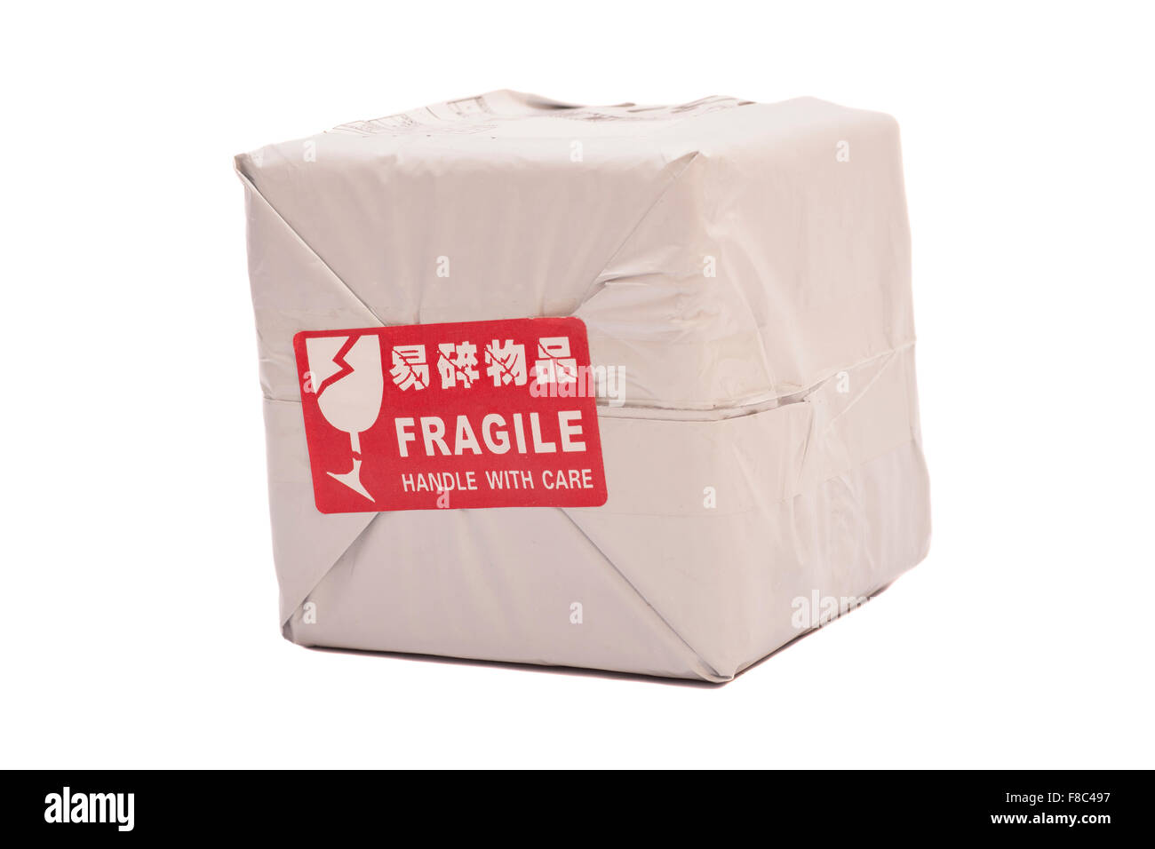 Postal package box or shipping box with a 'Fragile - Handle with Care' sticker Stock Photo