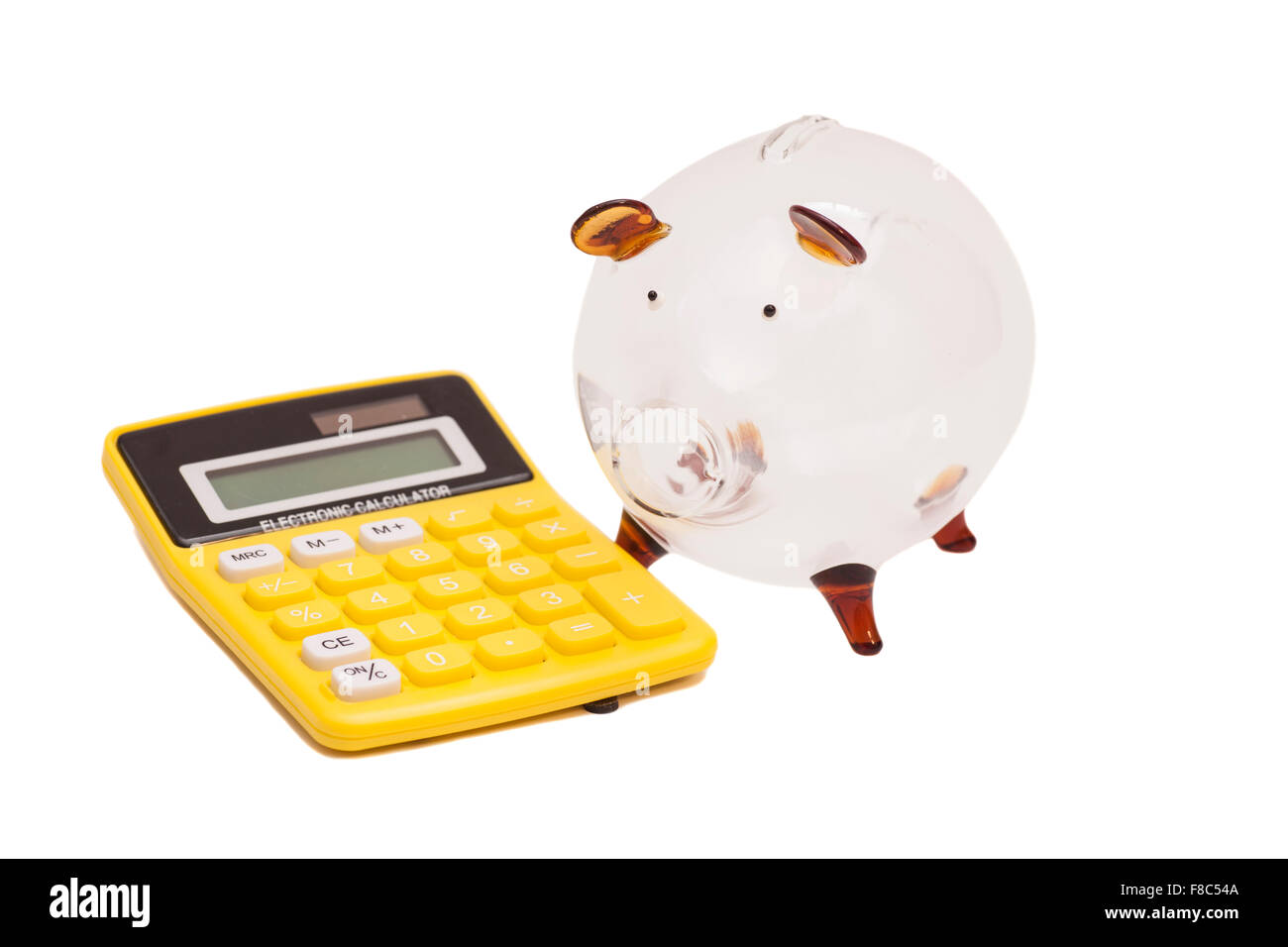 Piggy bank and calculator isolated on white background Stock Photo - Alamy
