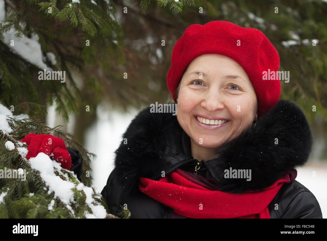 Mature woman outdoors winter trees hi-res stock photography and images ...