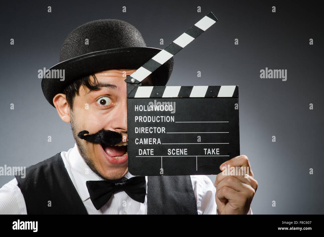Funny man with movie clapper board Stock Photo - Alamy