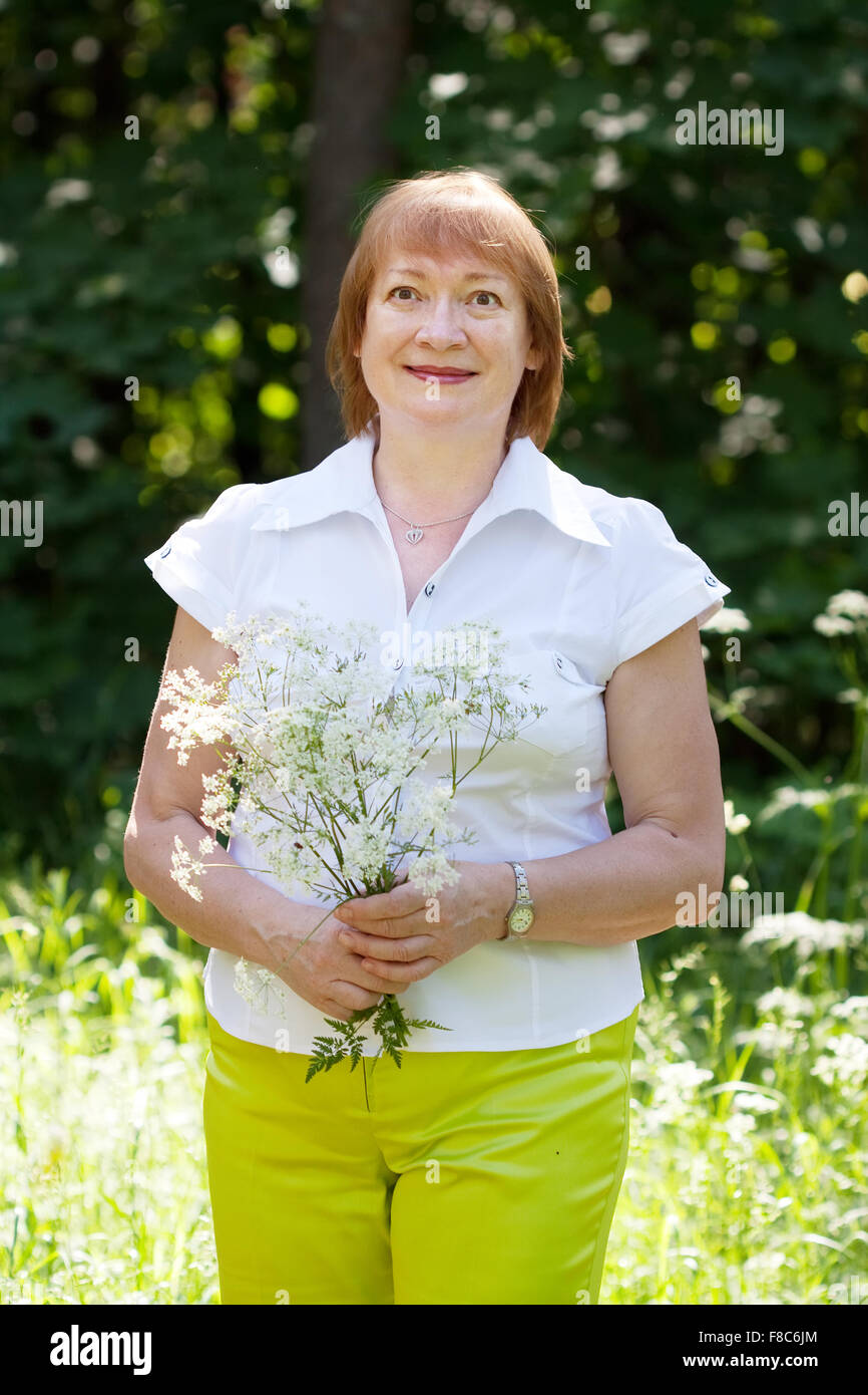 Outdoor portrait of smiling mature woman Stock Photo - Alamy