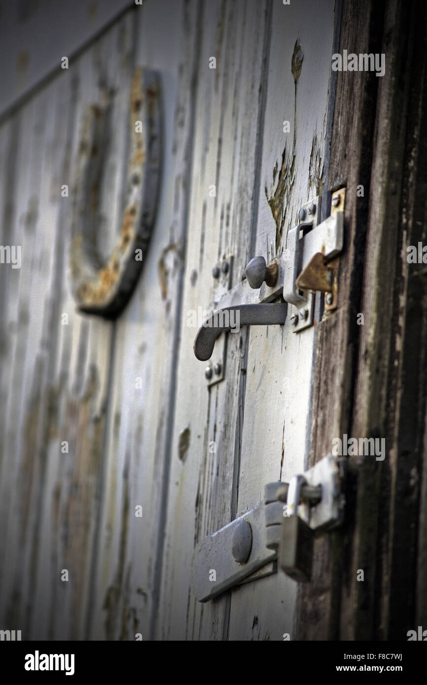 horseshoe on closed door Stock Photo