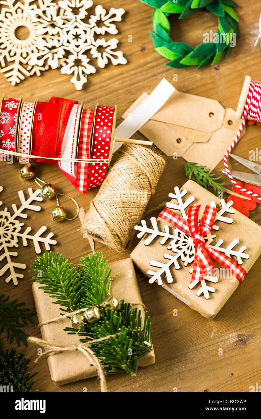 Wrapping Christmas gifts in recycled brown paper with vintage style at