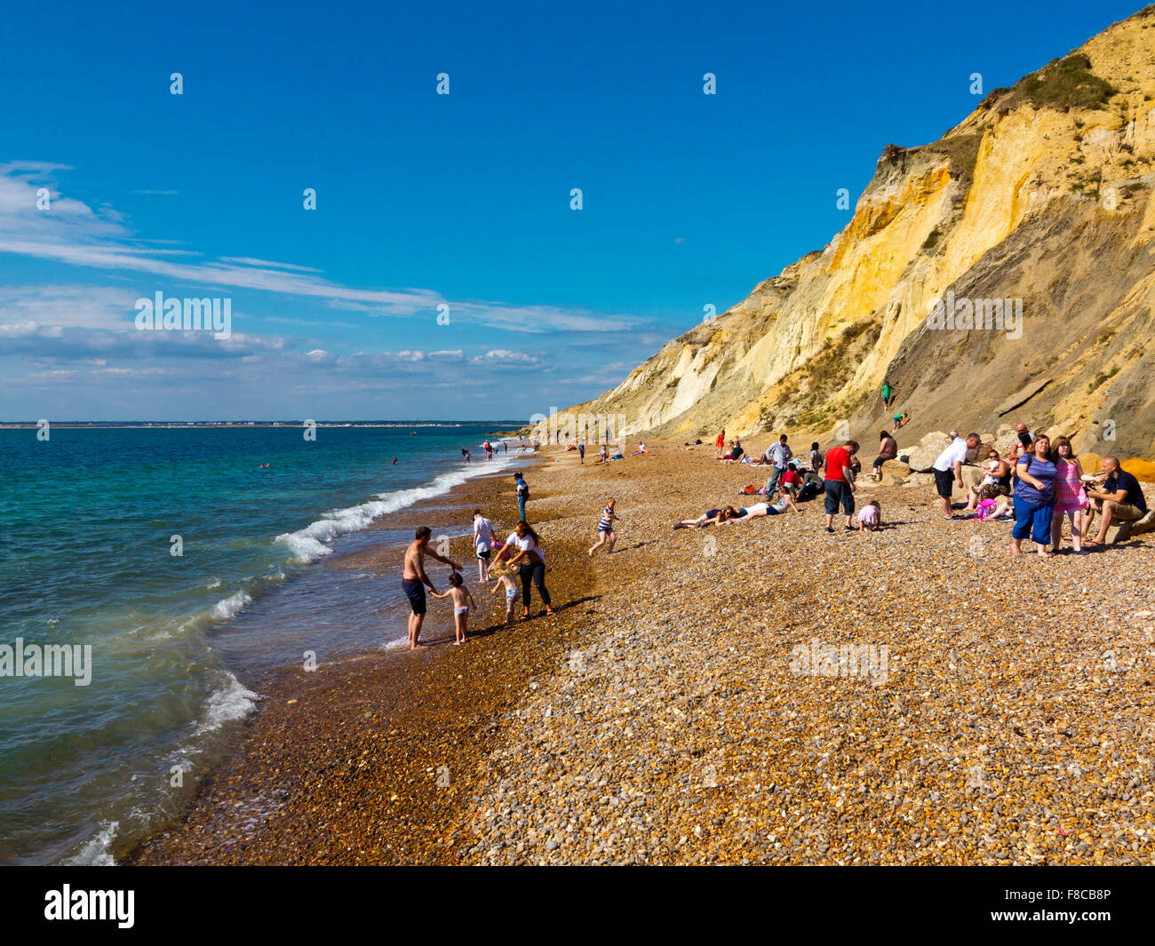 The beach at Alum Bay on the western tip of the Isle of Wight England UK famous for multicoloured sandstone cliffs Stock Photo