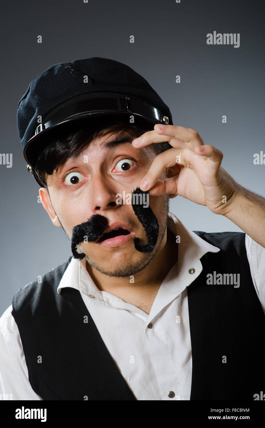 Funny taxi driver wearing peaked cap Stock Photo - Alamy