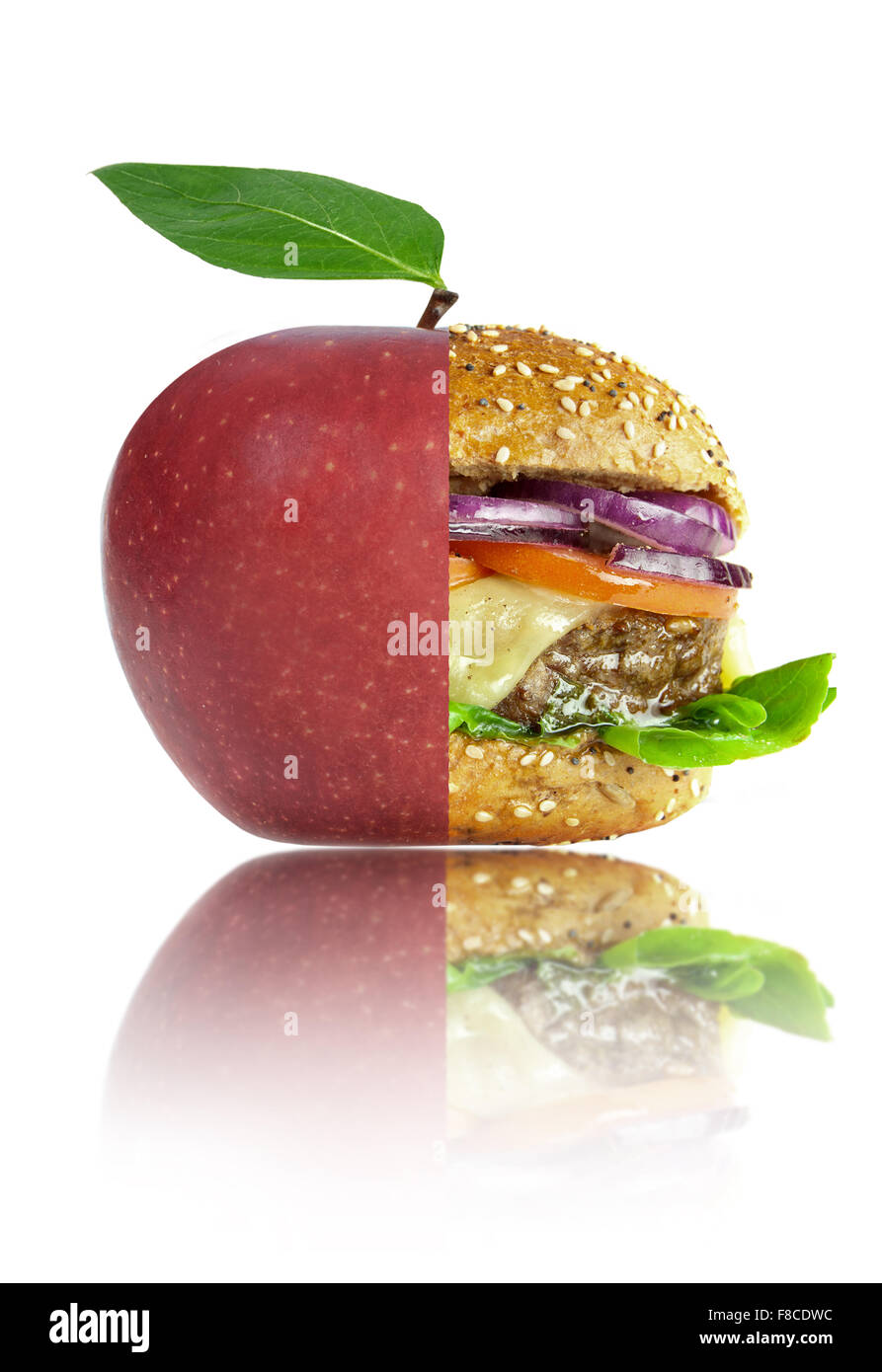 Healthy apple and unhealthy food lifestyle choices concept Stock Photo
