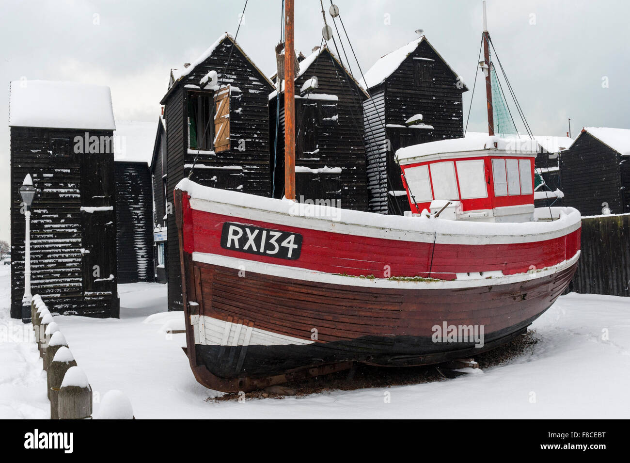 Fishing boat and net shops in the snow at Hastings, East Sussex