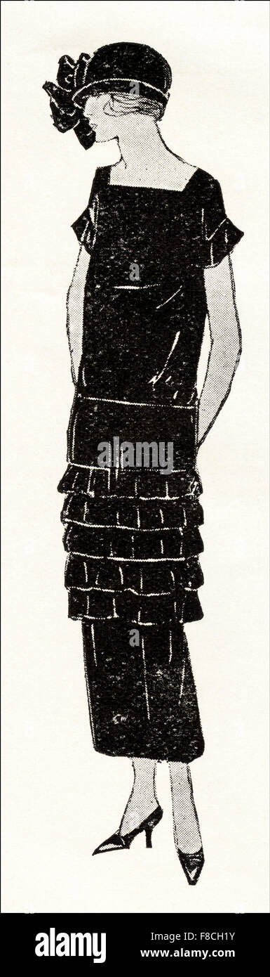 Flapper fashion of the 1920s. Black velvet frock with many small flounces. Stock Photo