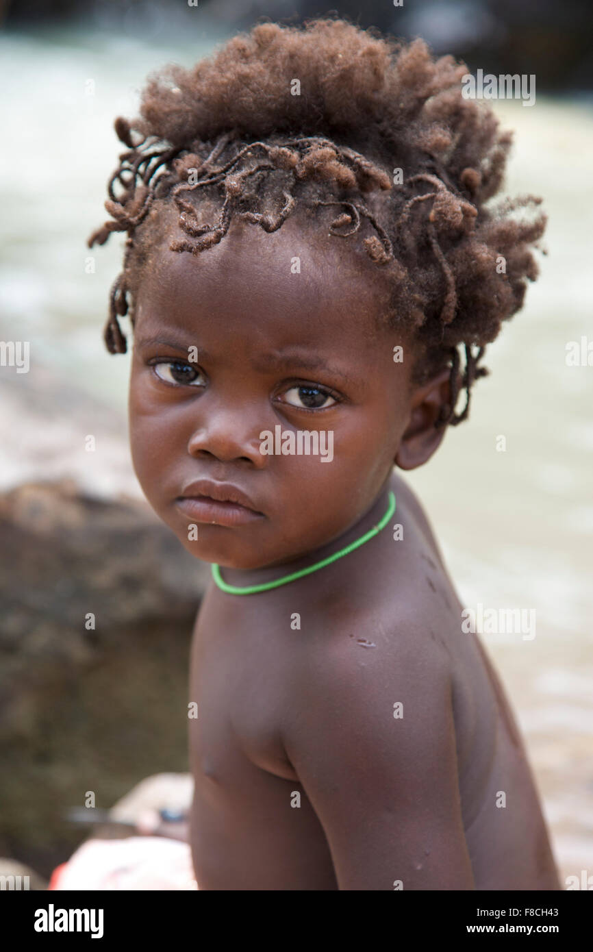 Portrait of a young kids from the Himba tribe, Namibia Stock Photo