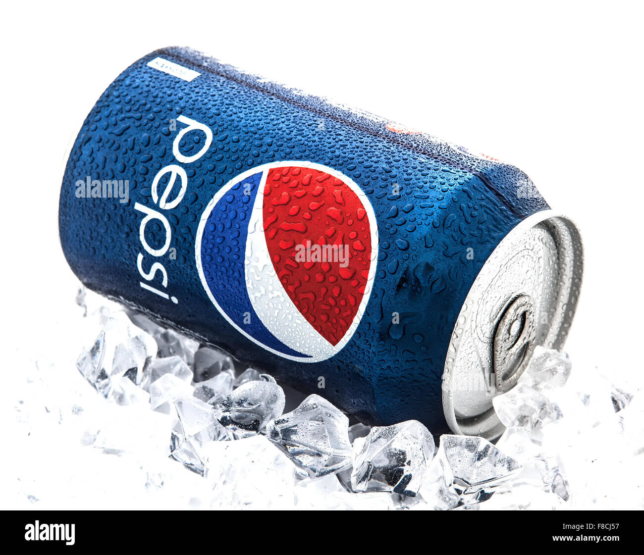 Can of Pepsi cola on a bed of ice and white background, Pepsi is a carbonated soft drink produced PepsiCo, Created in 1893 Stock Photo