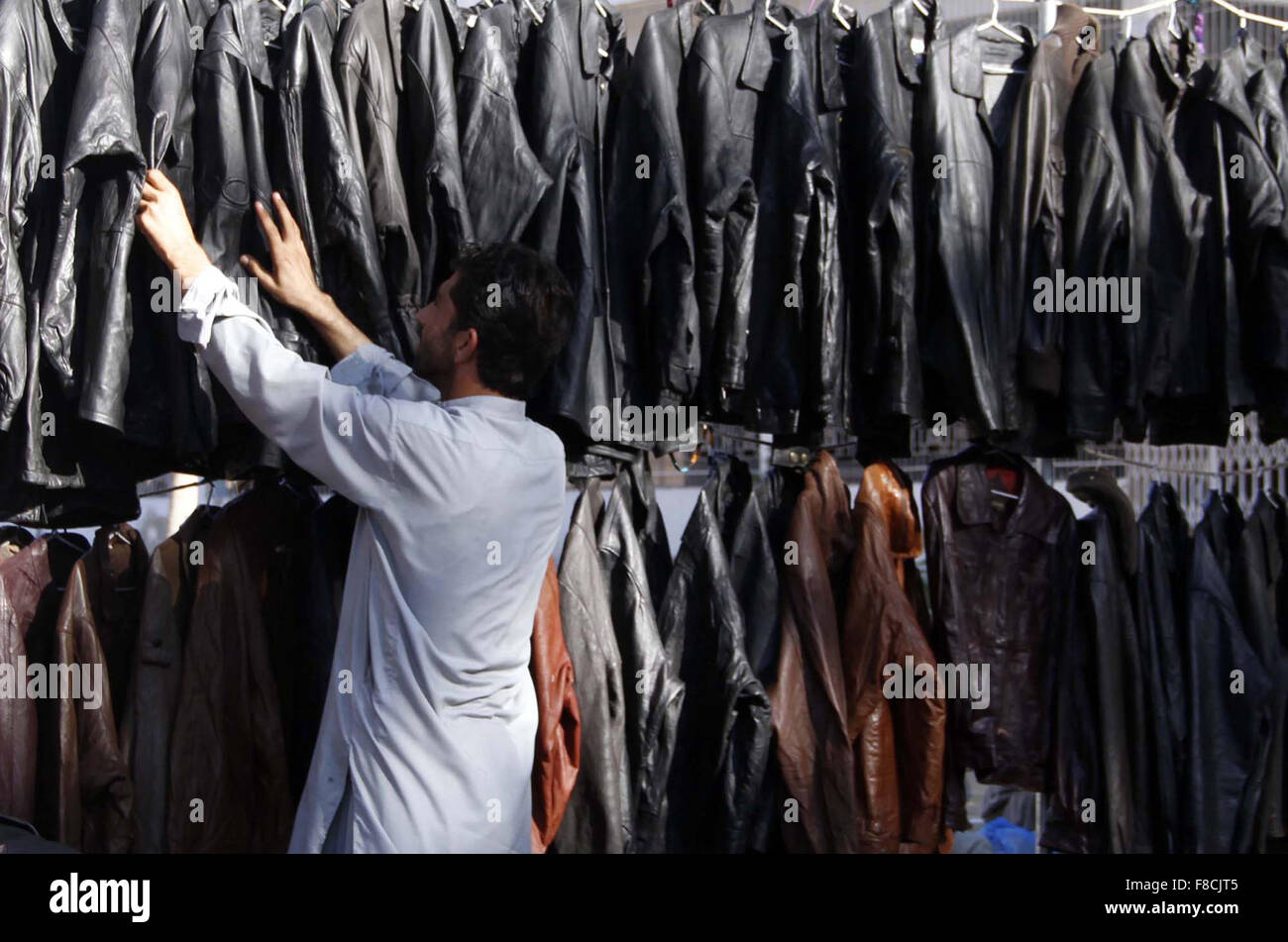 Vendor selling leather jackets to earn his livelihood for running  households on arrival of winter in Karachi, at a roadside stall on Tuesday,  December 08, 2015 Stock Photo - Alamy