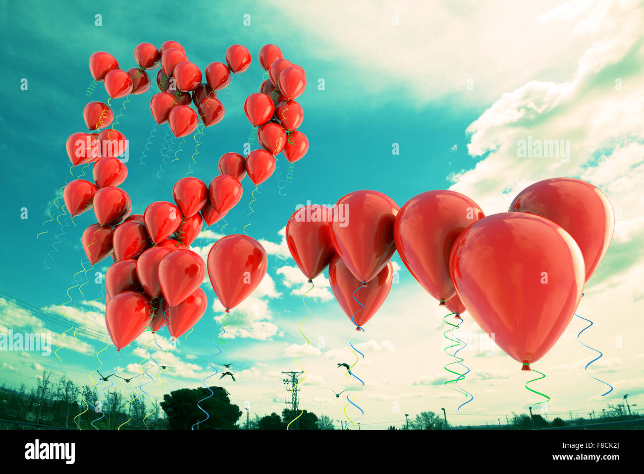 Balloons floating in the sky with heart shape Stock Photo - Alamy