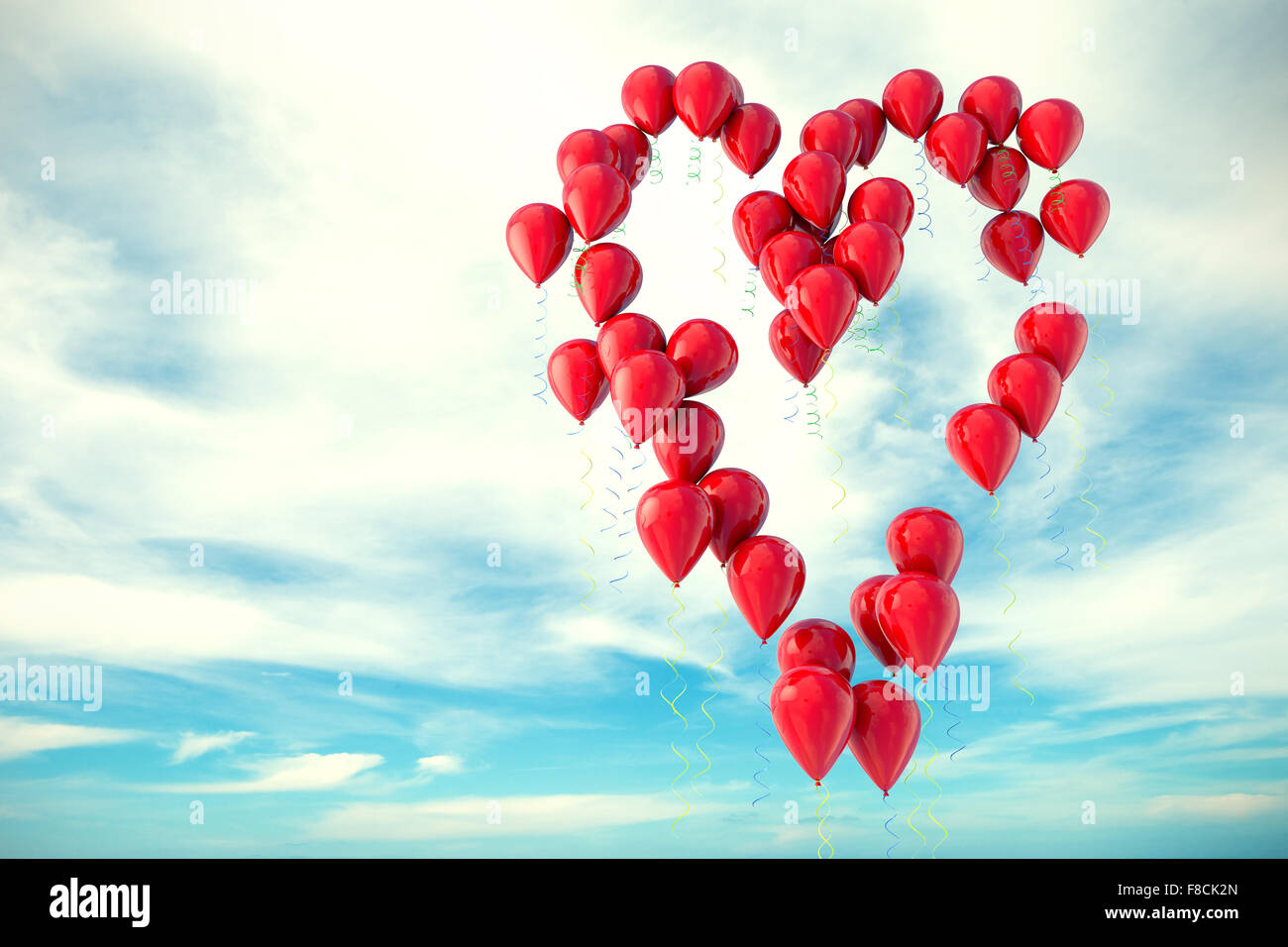 Balloons floating in the sky with heart shape Stock Photo - Alamy