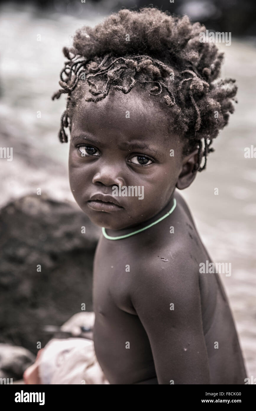 Portrait of a young kid from the Himba tribe, Namibia Stock Photo