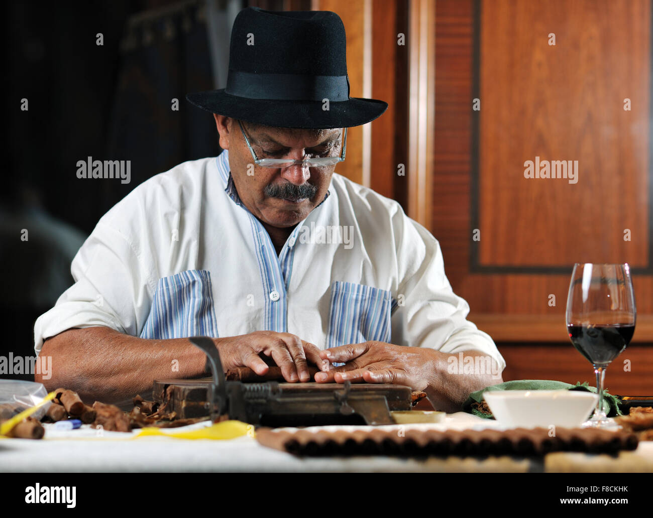 older senior man making luxury handmade cuban cigare Stock Photo