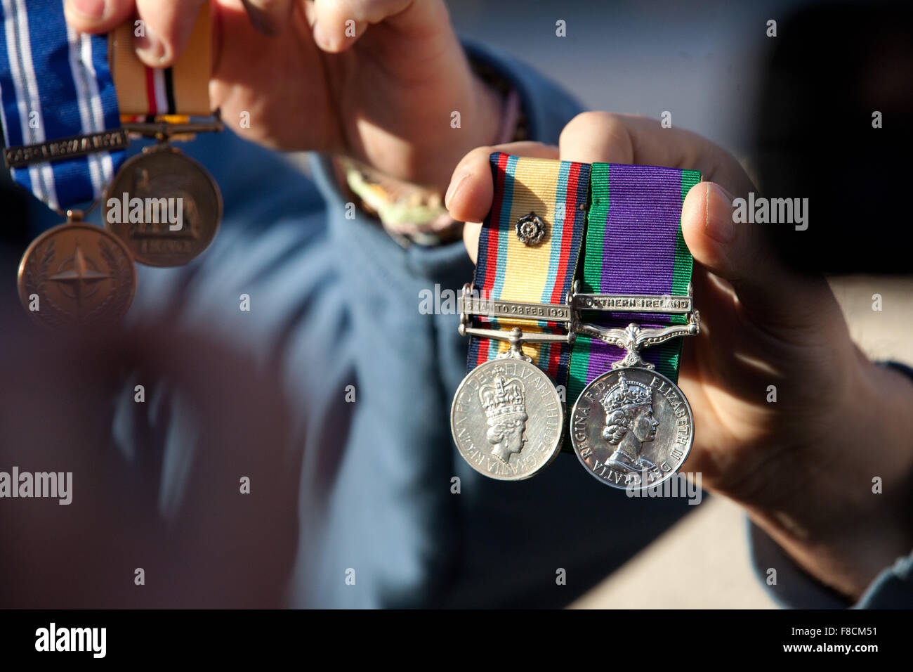 London, UK. 8th December, 2015. Members of Veterans for Peace UK display medals to be discarded in front of Downing Street in protest against airstrikes on Syria. Credit:  Mark Kerrison/Alamy Live News Stock Photo