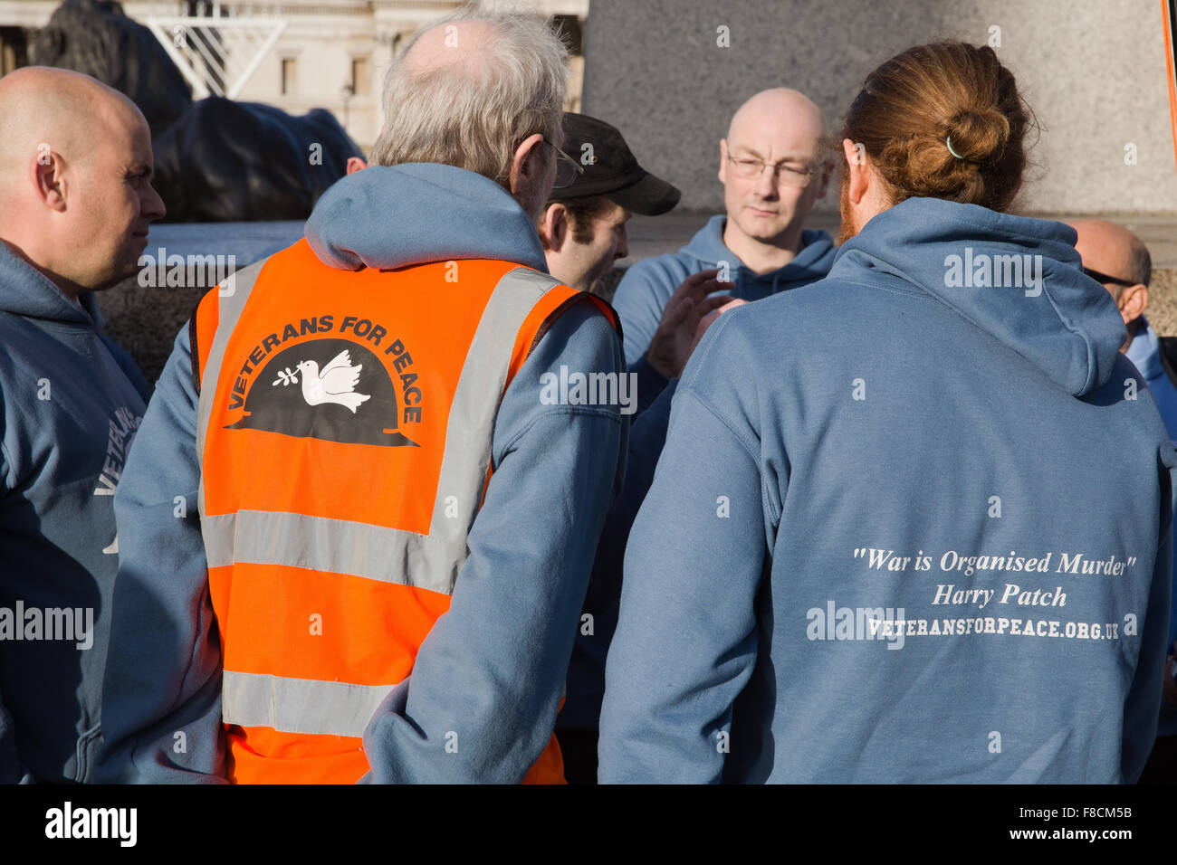 London, UK. 8th December, 2015. Members of Veterans for Peace UK in Trafalgar Square before the march to Downing Street. Credit:  Mark Kerrison/Alamy Live News Stock Photo