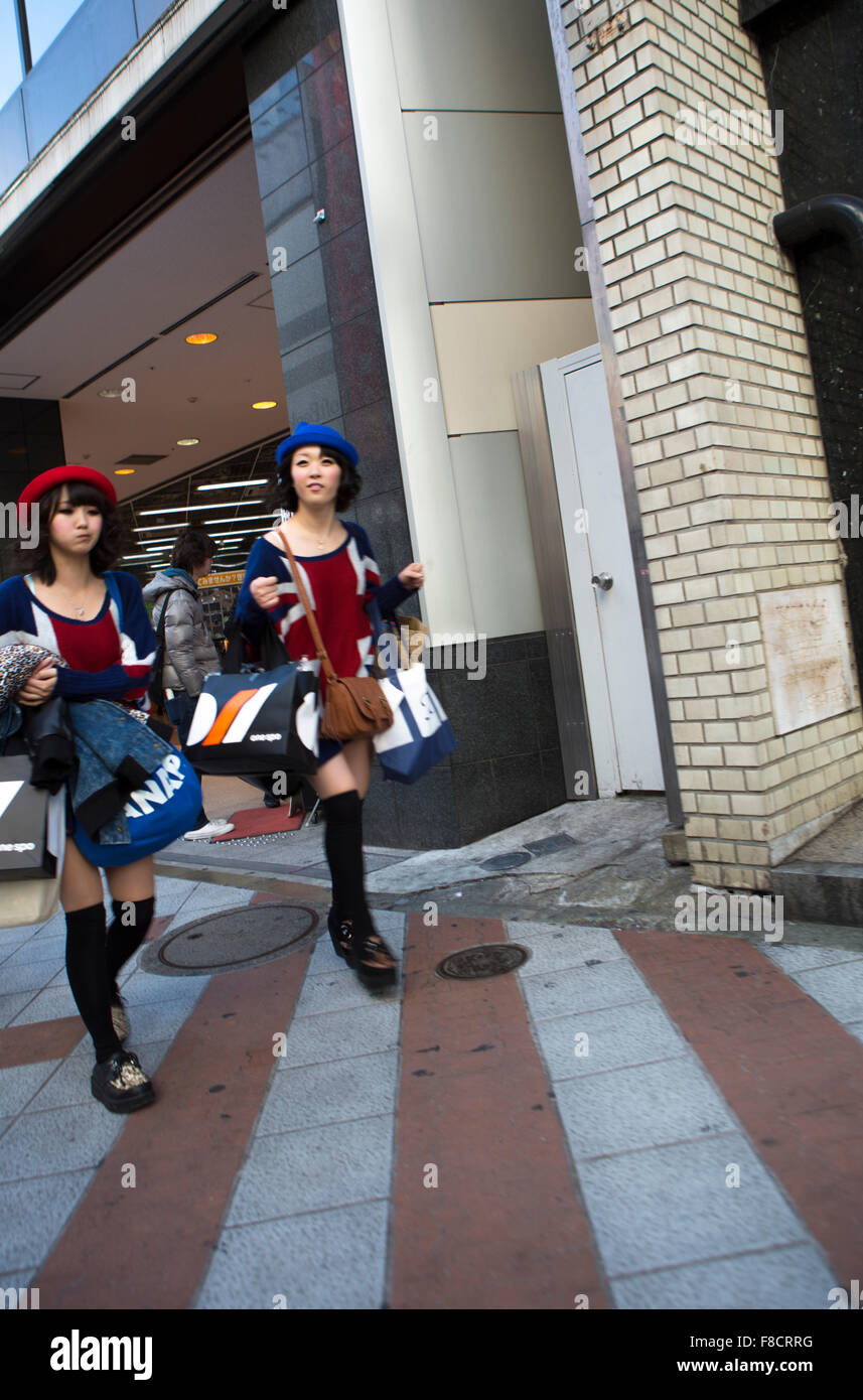 Shopping Spree: Women rushing out Luxury Boutiques with bags Stock Photo