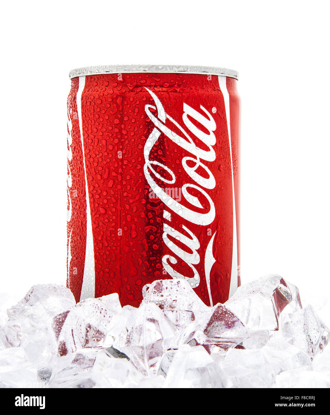Can of Coca-Cola on a bed of ice over a white background Stock Photo