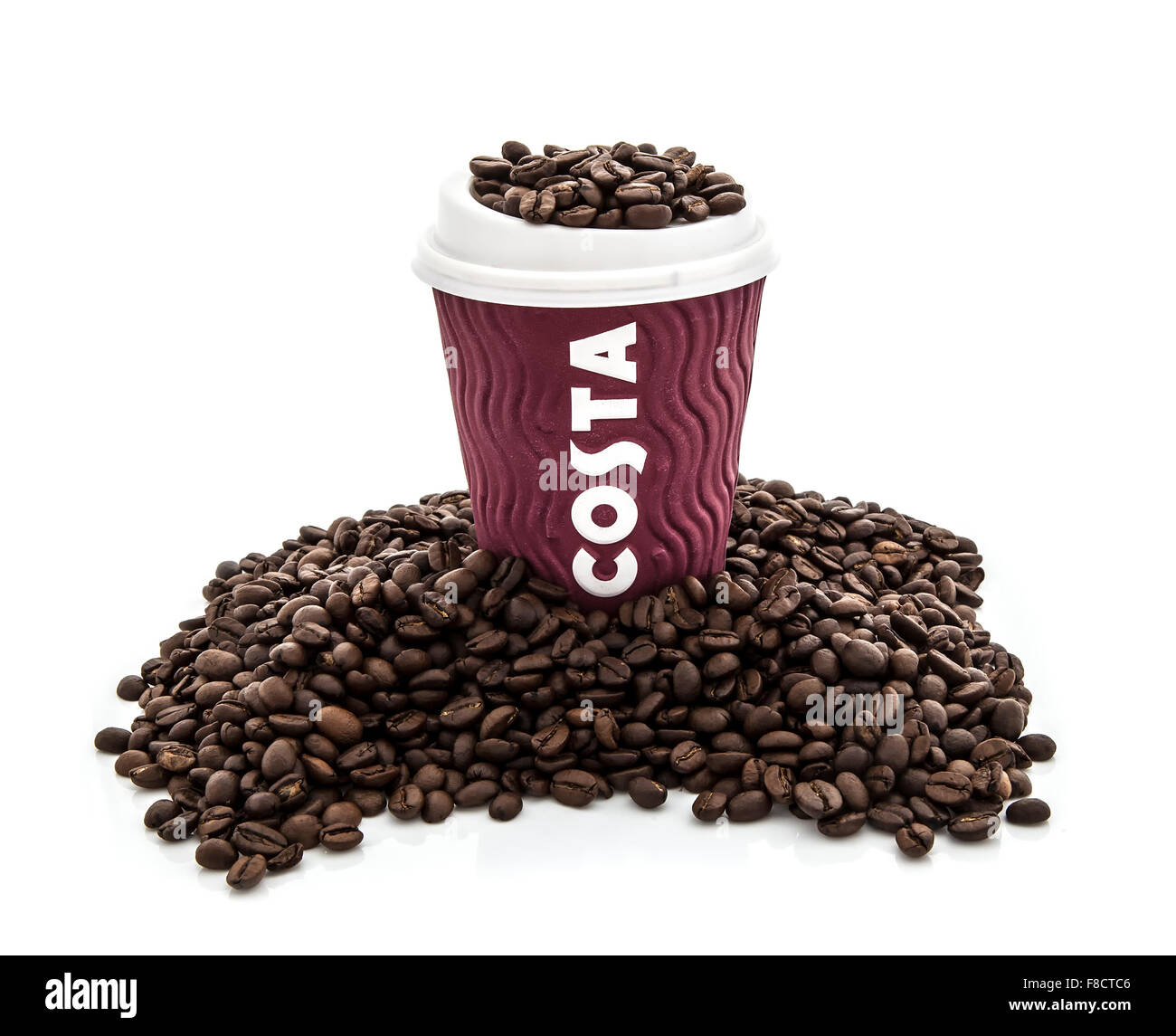 Costa Coffee cup with beans on a white background Stock Photo