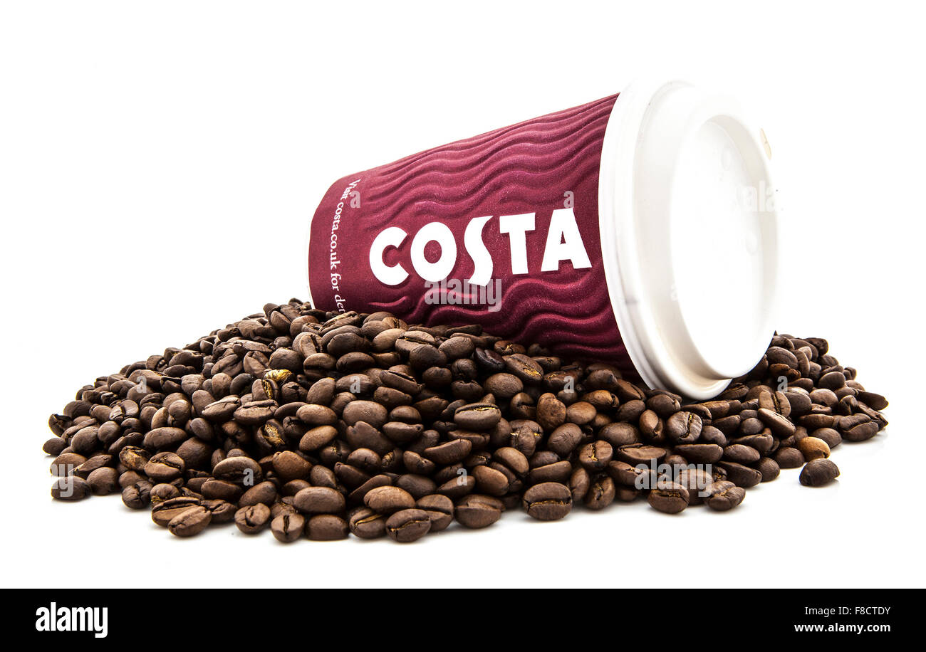 Costa Coffee take a way cup on a bed of fresh coffee beans. Stock Photo