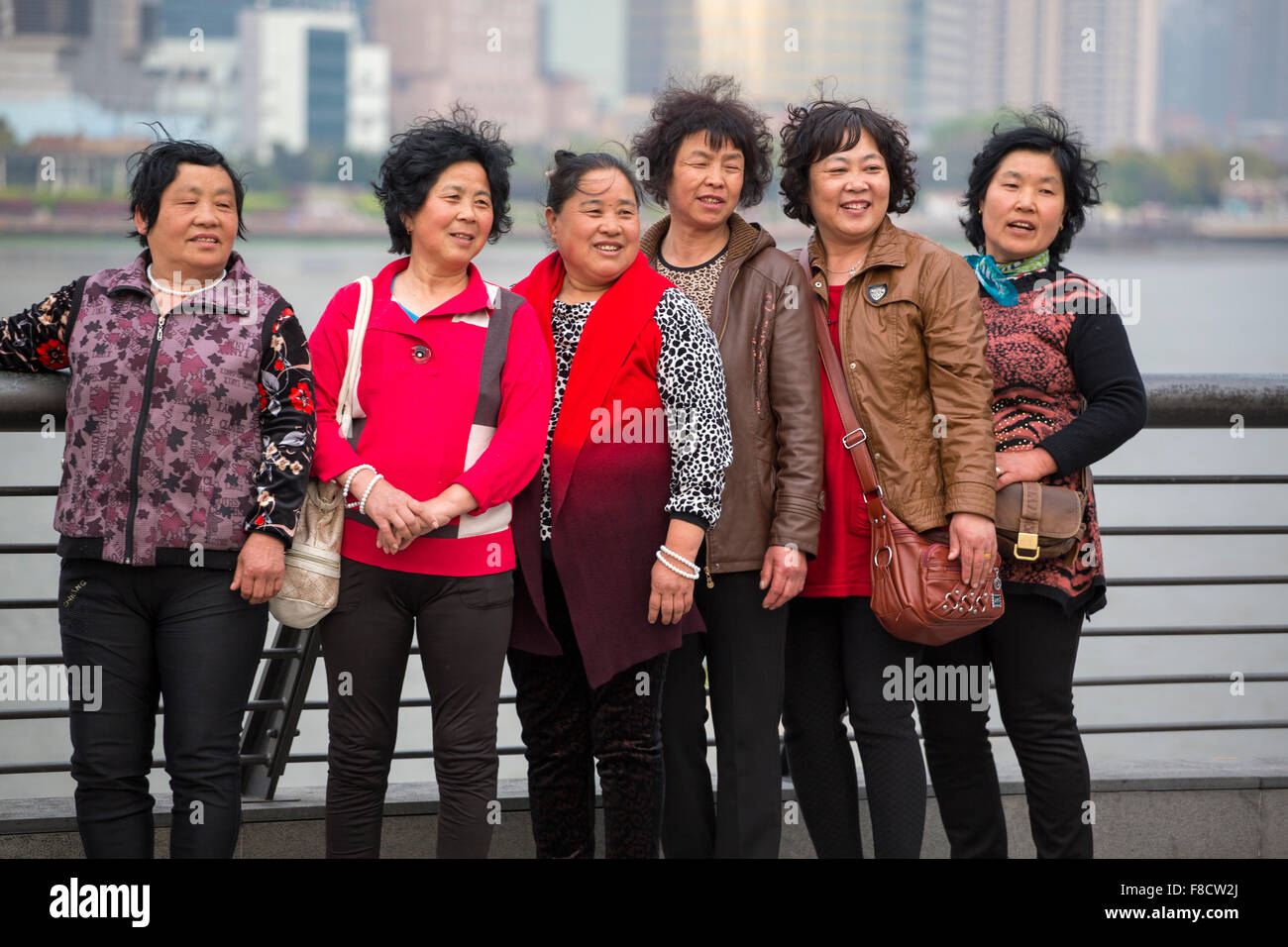 Group of women smiling and being taken in photo Stock Photo
