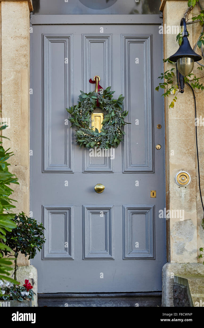 Christmas Wreath on  grey front door Stock Photo