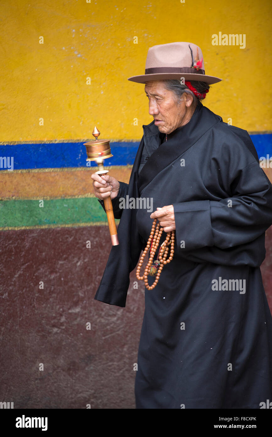 Tibetan woman praying around the Palkhor Temple Stock Photo