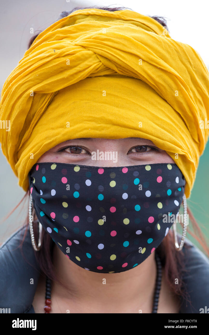 Portrait of a Tibetan woman wearing a mask Stock Photo