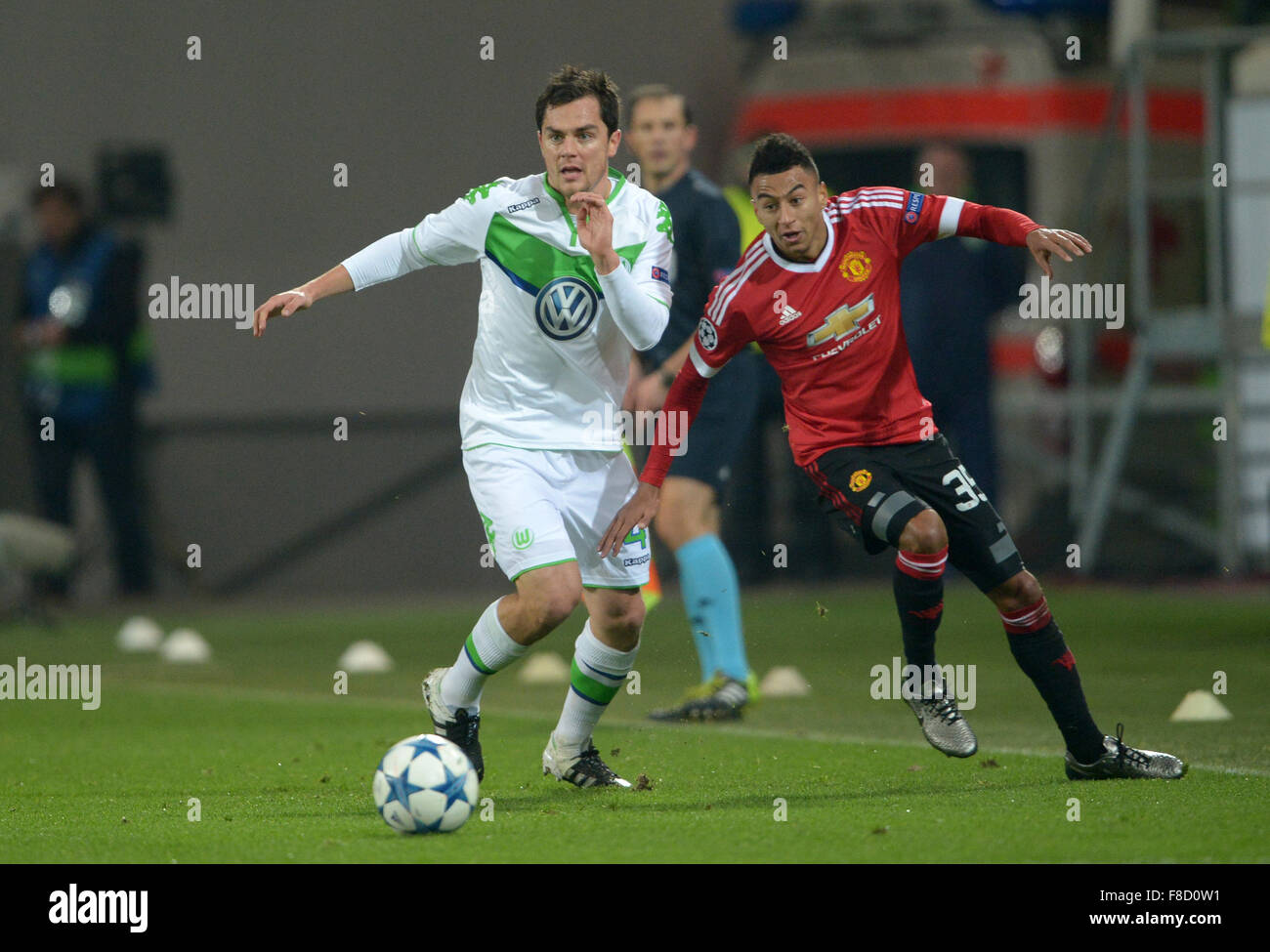 Wolfsburg, Germany. 08th Dec, 2015. Wolfsburg's soccer player Marcel Schäfer (L) and Manchester United's Jesse Lingard fight for the ball during the UEFA Champions League soccer match between VfL Wolfsburg and Manchester United at the Arena in Wolfsburg, Germany, 08 December 2015. Photo: Peter Steffen/dpa/Alamy Live News Stock Photo