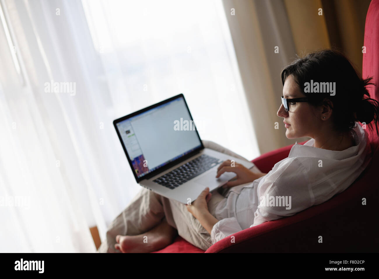 young beautiful woman using a laptop computer at home Stock Photo - Alamy