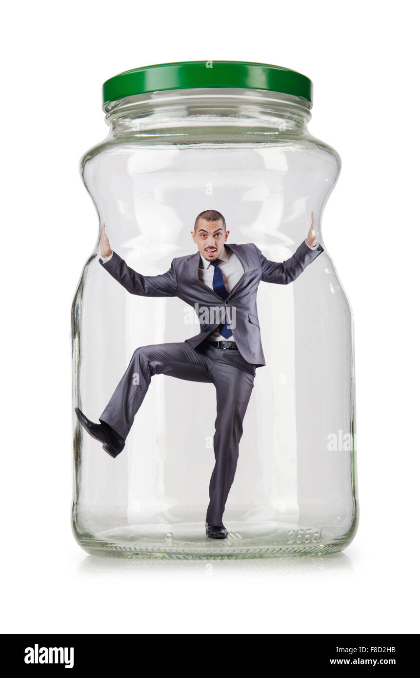 Young businessman in glass jar Stock Photo