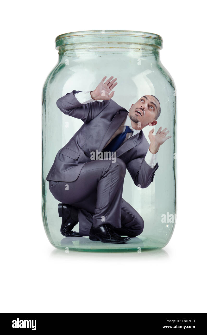 Young businessman in glass jar Stock Photo