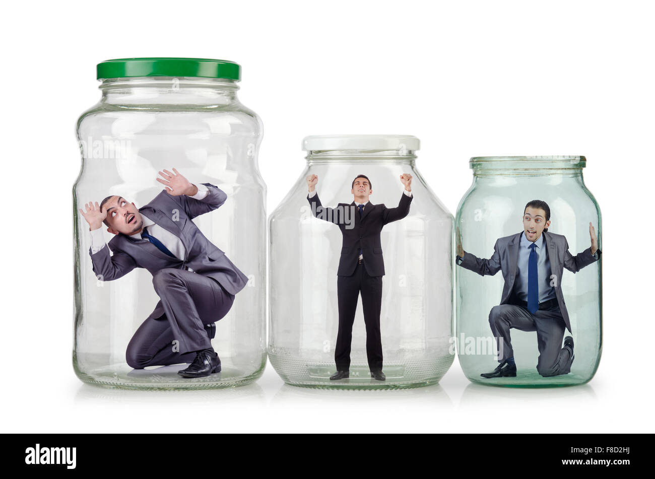 Young businessman in glass jar Stock Photo