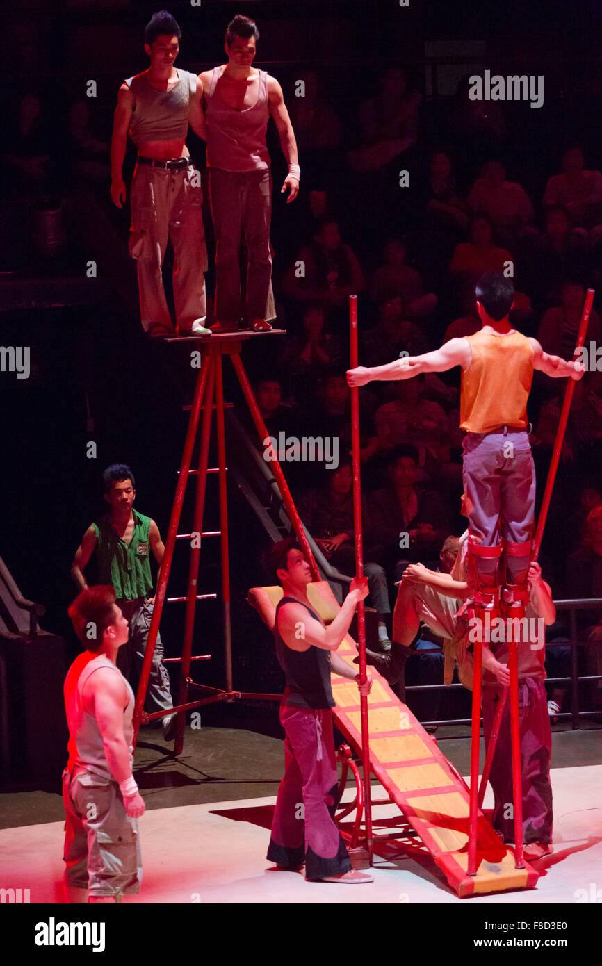 Acrobats hanging on a wire. China Stock Photo
