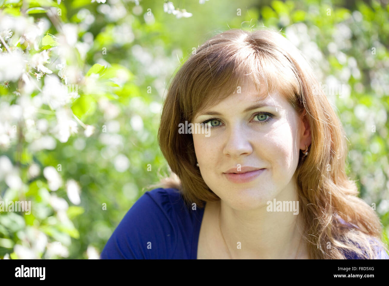 portrait of girl in spring blossoming garden Stock Photo - Alamy