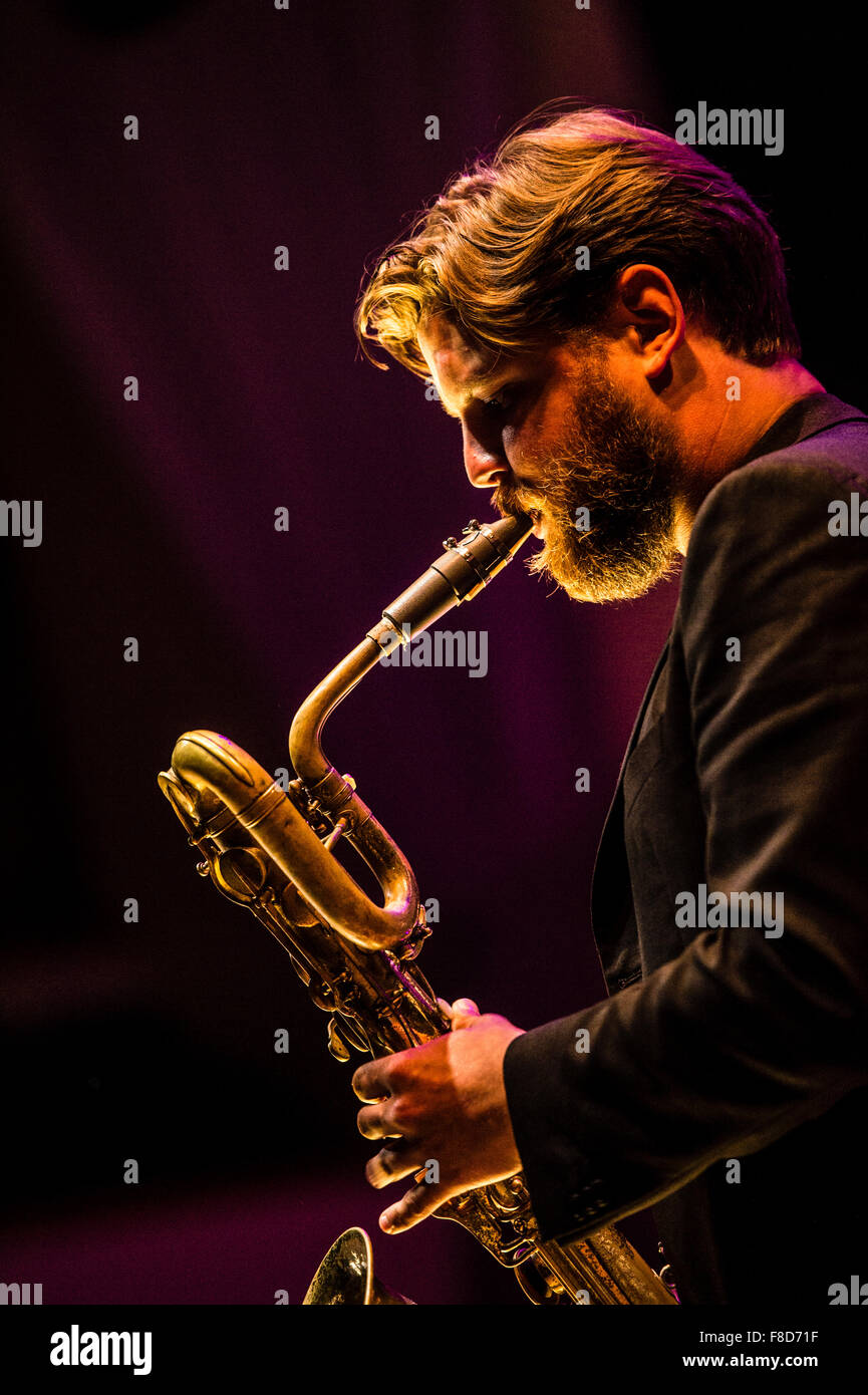 Jazz music : a musician playing a saxophone in a group Stock Photo