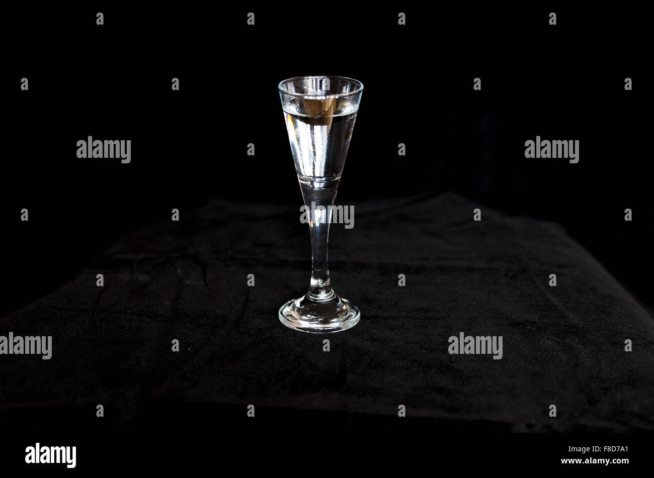a cold shot in a black background ready to drink Stock Photo - Alamy