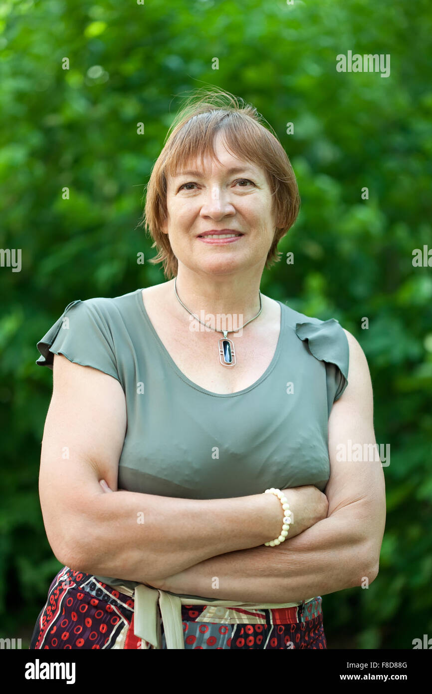 Outdoor portrait of smiling mature woman Stock Photo - Alamy