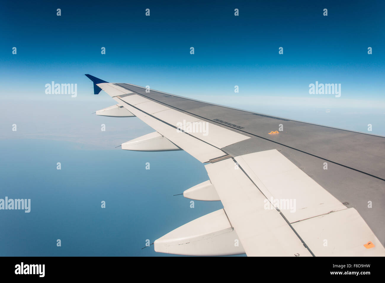 Airplane wing out of window Stock Photo - Alamy